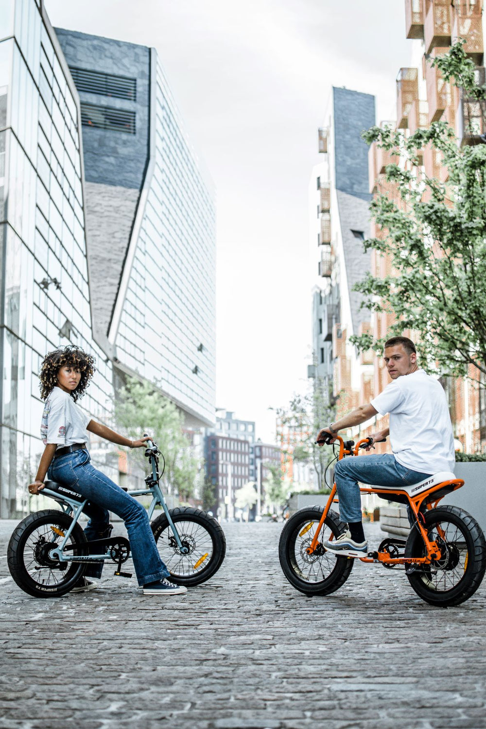 two super73-zg electric bicycles, super73-zg Astro Orange and super73-zg Agave Green