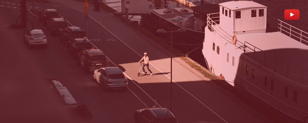 man riding an urban electric scooter from eltra, red filter and youtube logo